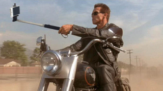 Illustration for article titled Photoshopped Movie Stills Replace Guns With Selfie Sticks